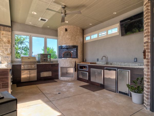 Beautiful custom outdoor kitchen under a covered patio