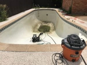 a pool that was full of algae is now drained