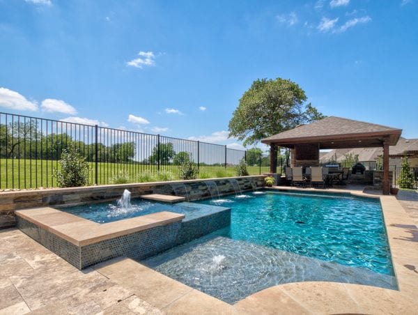Beautiful outdoor pool, spa, and outdoor kitchen.