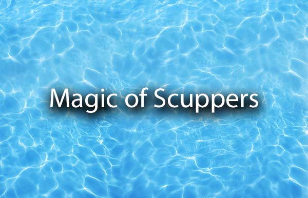 Crystal clear water with the words, magic of scuppers.