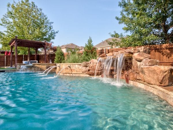 Natural Looking Fountains Flowing Into a Pool.
