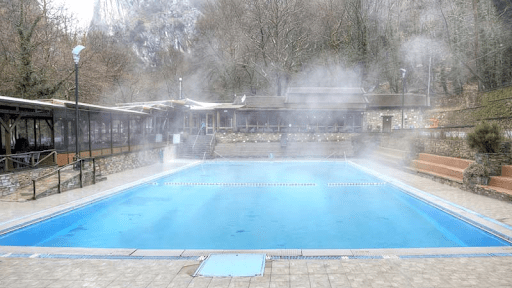A beautiful shot of steam coming off of a heated pool.