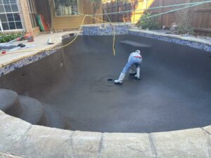 A pool finished with construction and not yet filled with water